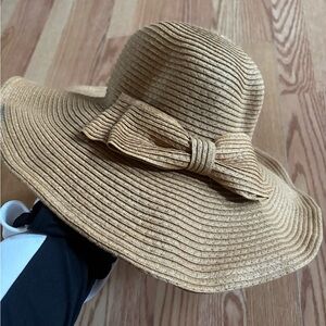 Elegant Tan Wide-Brimmed Hat with Bow